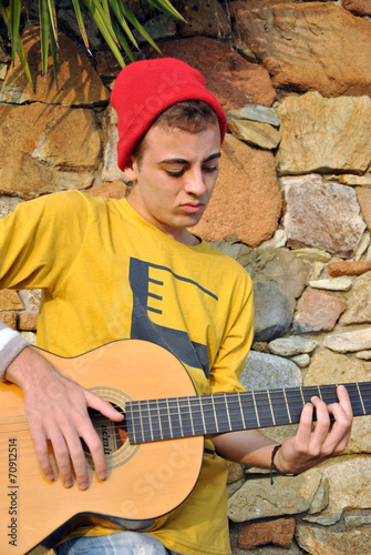 modern musician posing with his guitar © expressiovisual