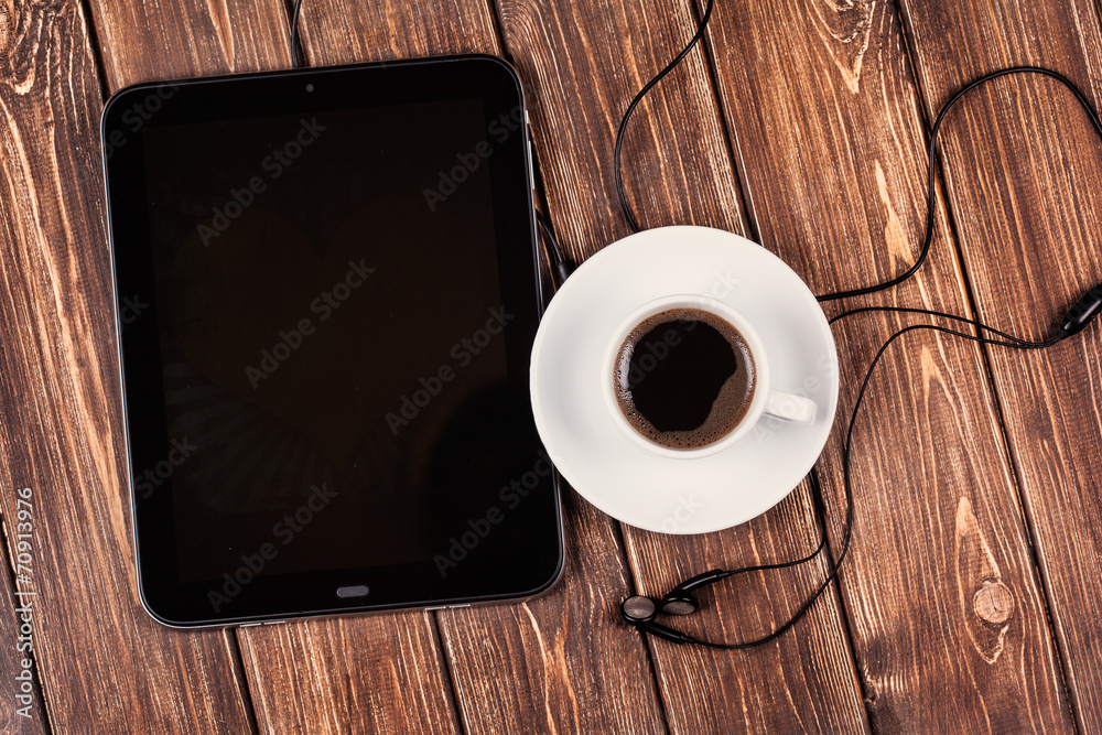 empty tablet pc and a coffee empty tablet pc and a coffee