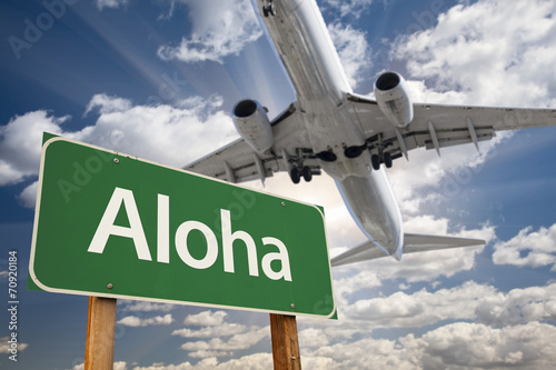 Aloha Green Road Sign and Airplane Above