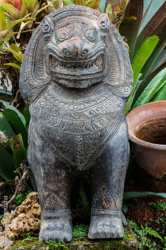 Stone statue of a lion-like creature in Thailand