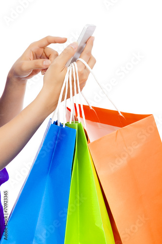 close-up shot of a person holding a cell phone to shop online