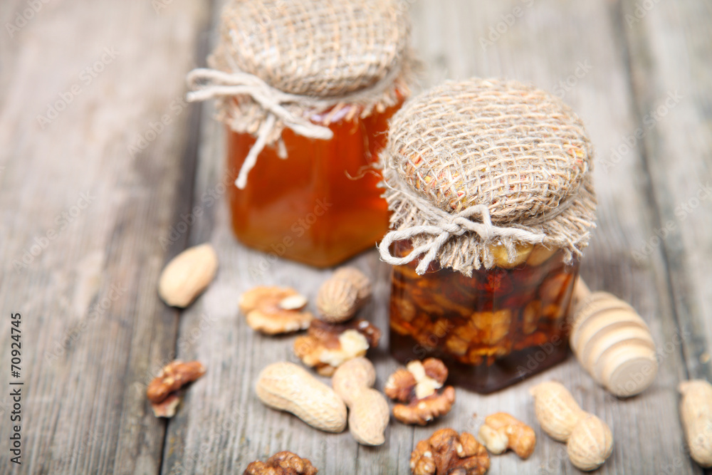 Honey in the pot and nuts