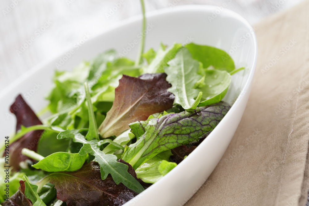 mesclun mix salad in white bowl