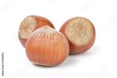 three whole hazelnuts