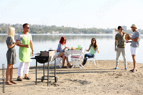Young friends having barbec...