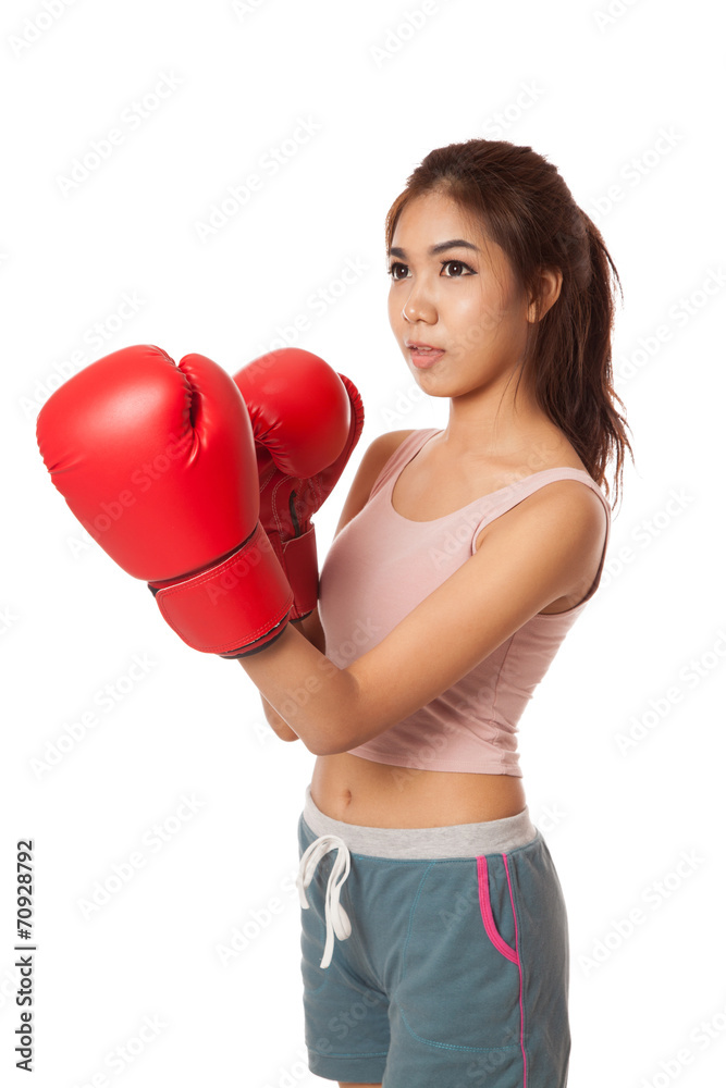 Asian slim girl with red boxing glove Asian slim girl with red boxing glove