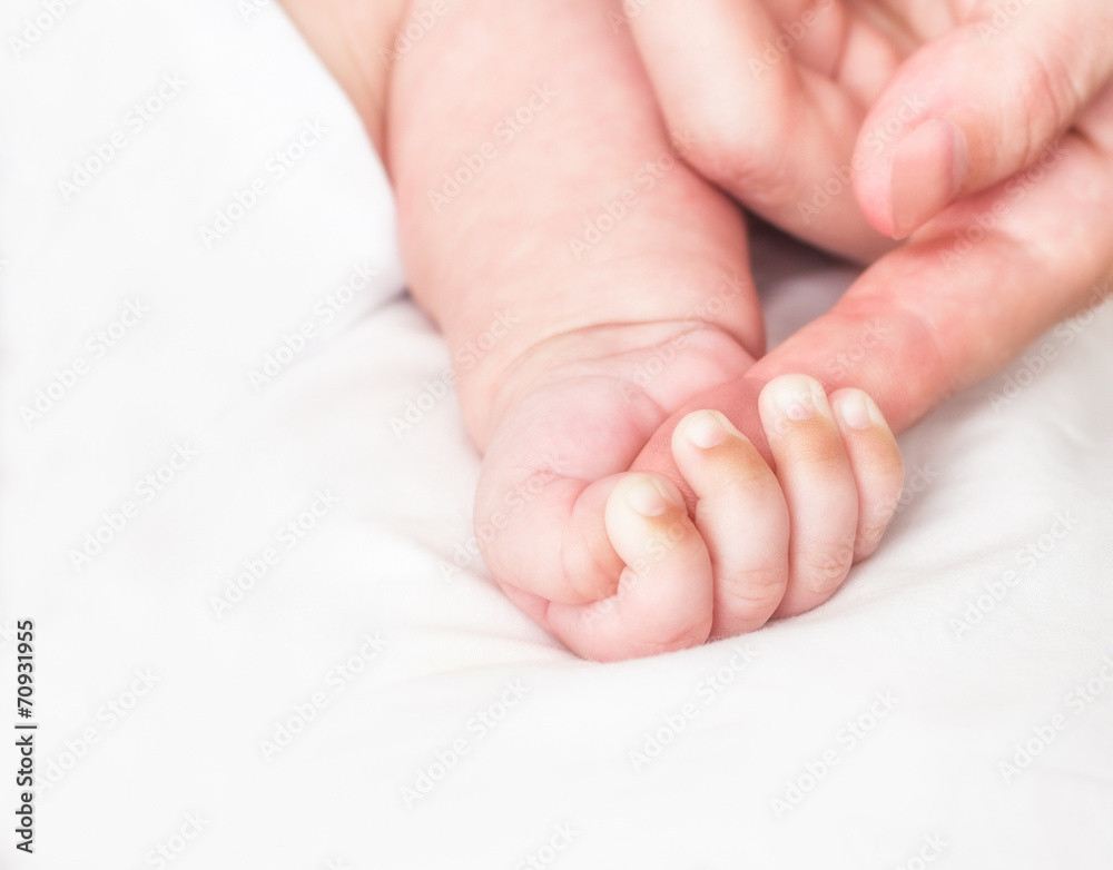 Baby and mother's finger