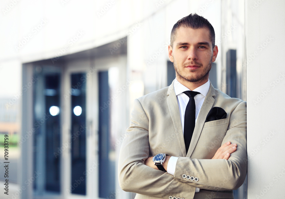 Fototapeta premium Portrait of an handsome businessman in an urban setting
