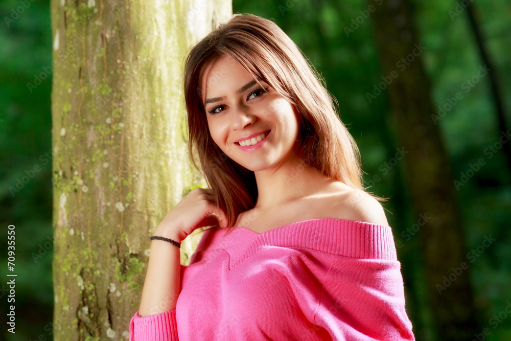 young adorable woman closeup portrait near tree young adorable woman closeup portrait near tree