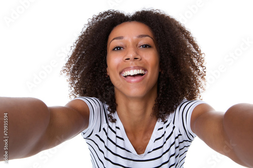 Smiling young black woman making selfie