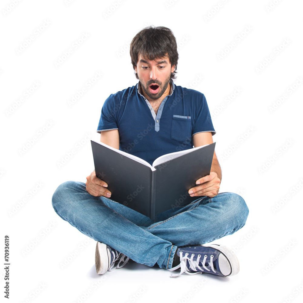 Man reading a book over white background Man reading a book over white background