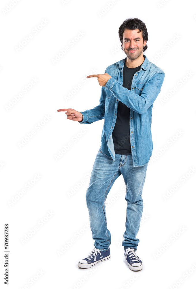 Man pointing lateral over white background Man pointing lateral over white background