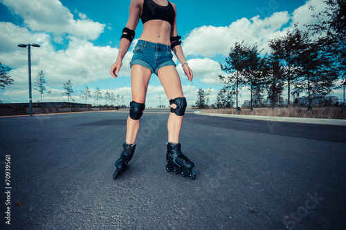 Young woman rollerblading © LoloStock