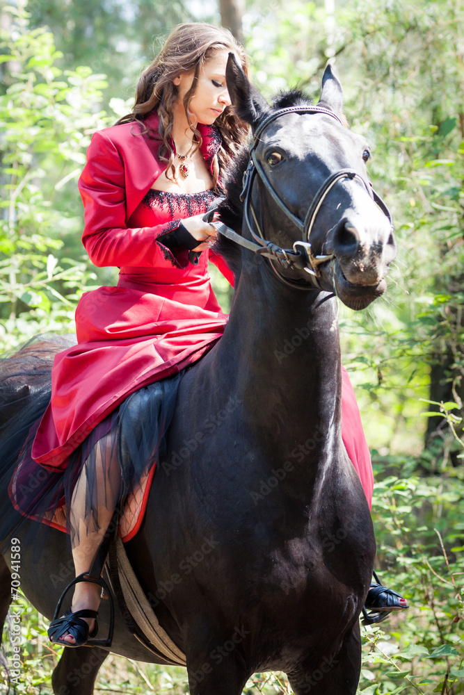 Obraz premium brunette girl on horse
