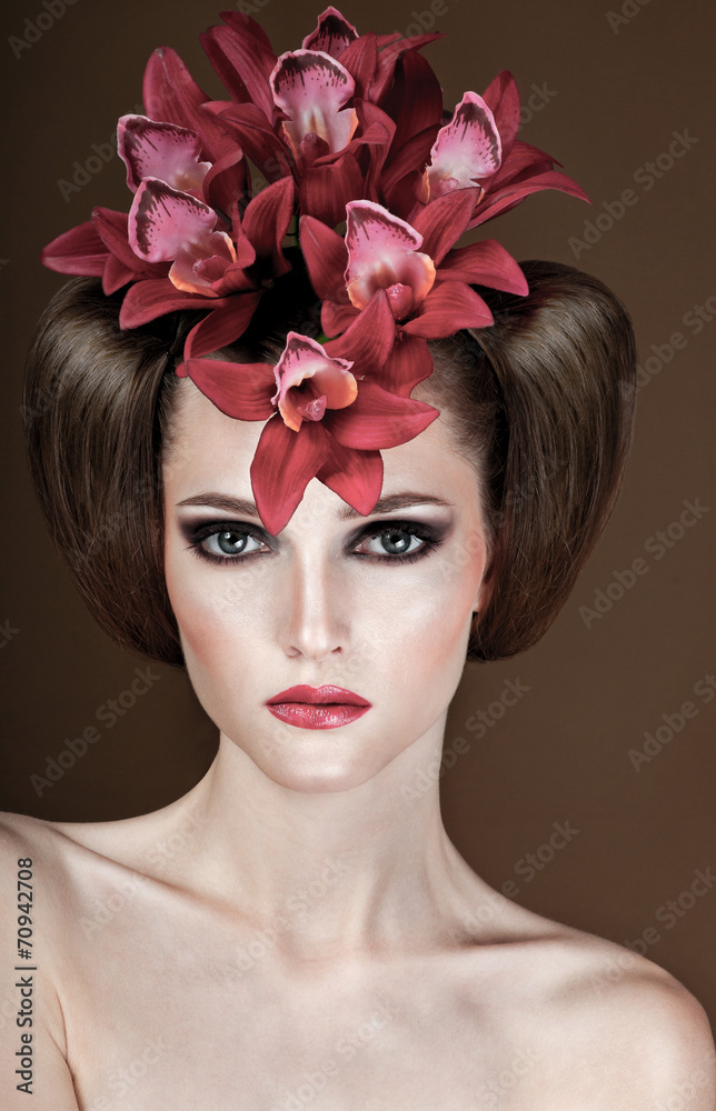 fashion model with hairstyle and flowers in her hair.