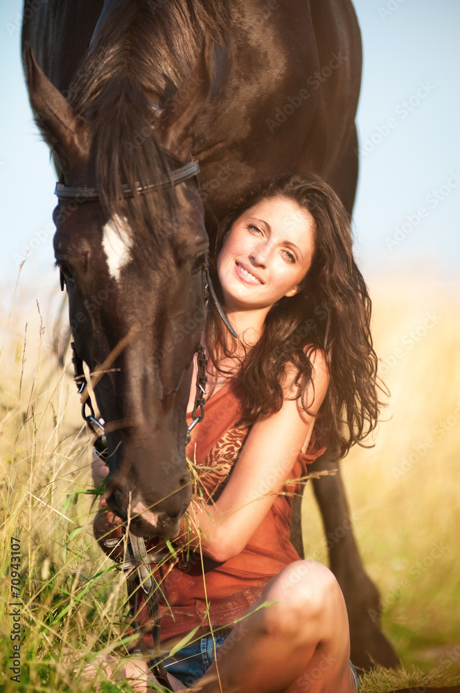 Fototapeta premium Young beautiful girl with a horse