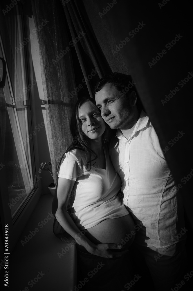 Couple expecting baby. Happy future dad and his pregnant wife Couple expecting baby. Happy future dad and his pregnant wife