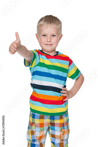 Cute little boy holds his thumb up