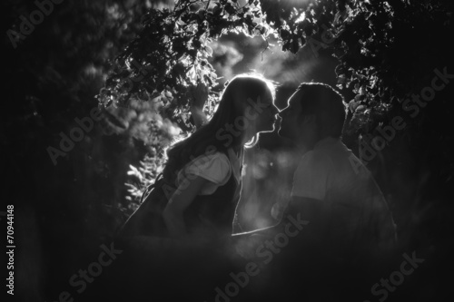 Image of happy future dad kiss the belly of his pregnant wife