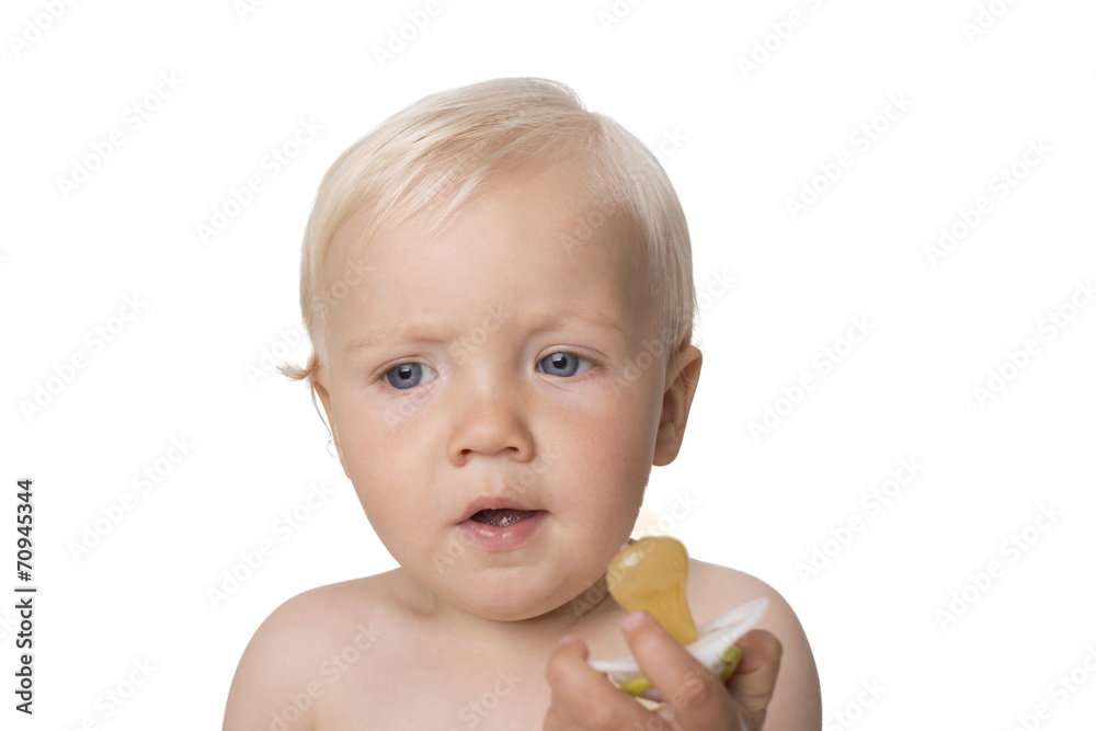 Surprised one year old boy with dummy Surprised one year old boy with dummy