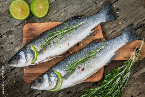 Two raw seabass with lime and rosemary