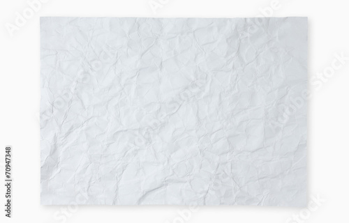 Crumpled white paper on white background