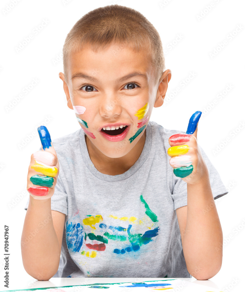 Portrait of a cute boy playing with paints Portrait of a cute boy playing with paints