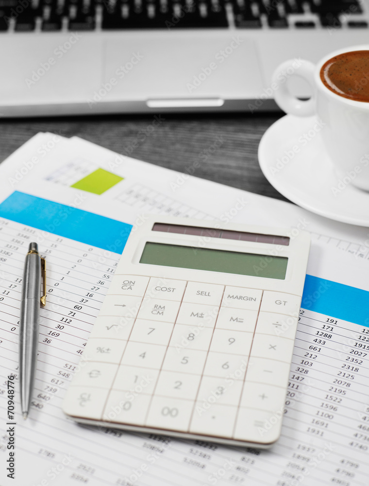 Calculator and financial papers Calculator and financial papers