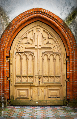 Old wooden door with carvings