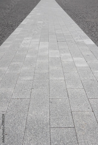 Pavement on gray cobblestone road