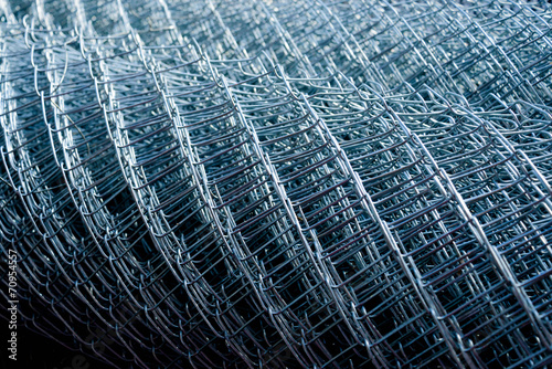 rolled supplies of shiny new chain link fence