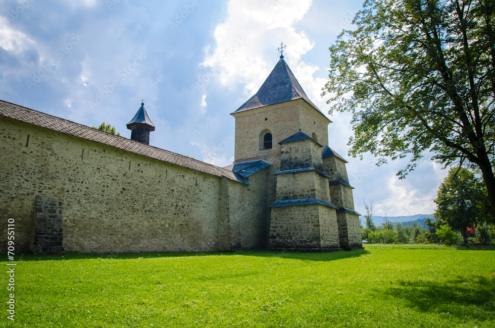 Old Romanian medieval monastery fortification with stone wall