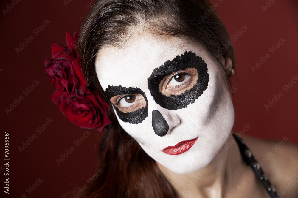 Woman with makeup of la Santa Muerte with red roses Woman with makeup of la Santa Muerte with red roses