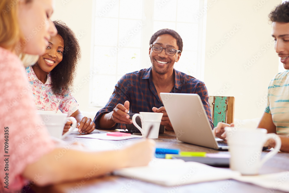 Group Of Business People Sitting Around Table In Meeting Group Of Business People Sitting Around Table In Meeting