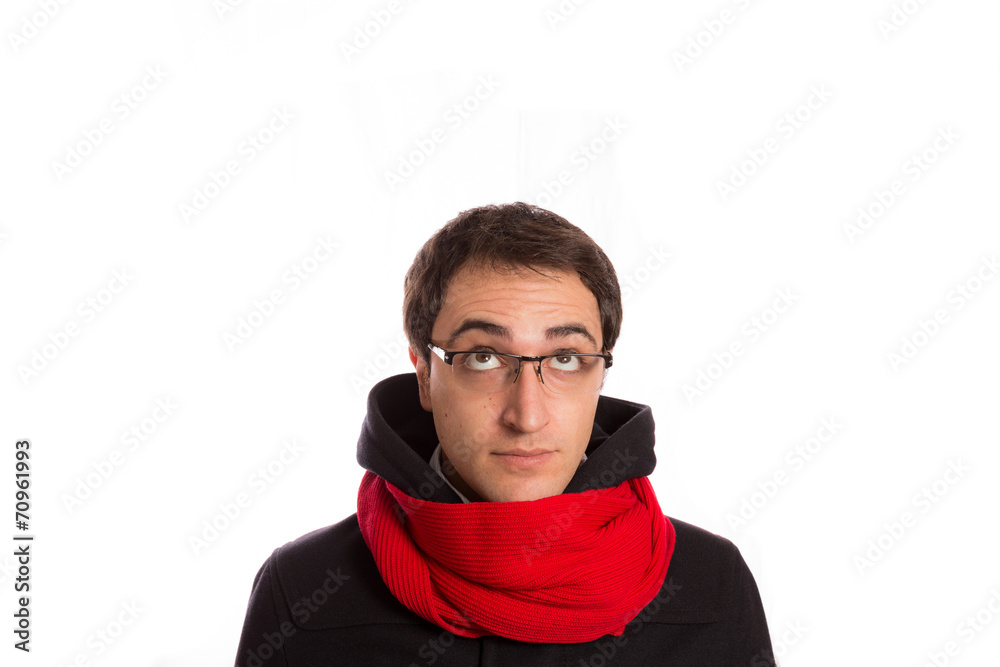 young man with montgomery and red scarf looks up , isolated on young man with montgomery and red scarf looks up , isolated on