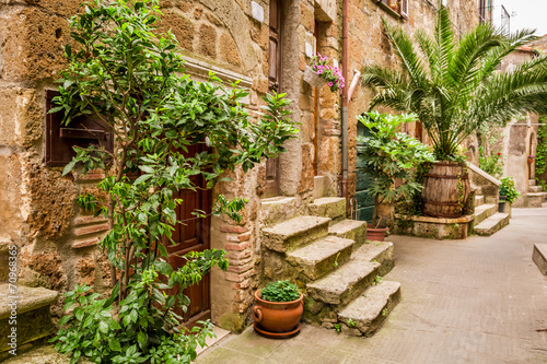 Porches full of flowers on the street in Tuscany