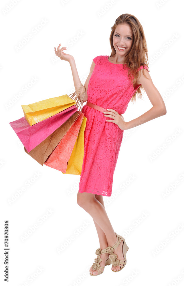 Beautiful young woman with shopping bags isolated on white Beautiful young woman with shopping bags isolated on white