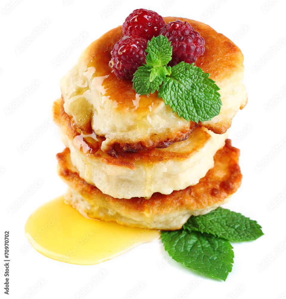 Tasty pancakes with fresh berries and mint leaf, isolated Tasty pancakes with fresh berries and mint leaf, isolated