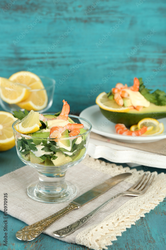 Tasty salads with shrimps and avocado in glass bowl and Tasty salads with shrimps and avocado in glass bowl and