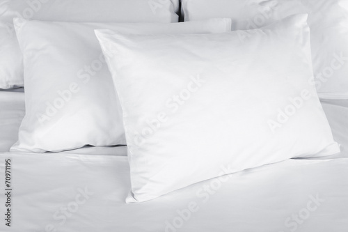 White pillows on bed close up photo