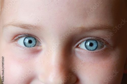 teen's blue eyes staring up