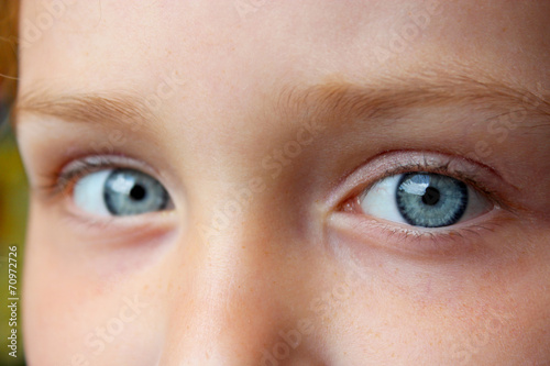 Photography teen's blue eyes staring up