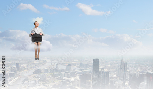 Woman on cloud © Sergey Nivens