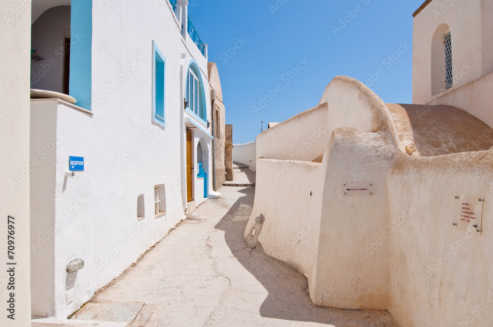 Typical street in Fira town on Santorini, Greece.