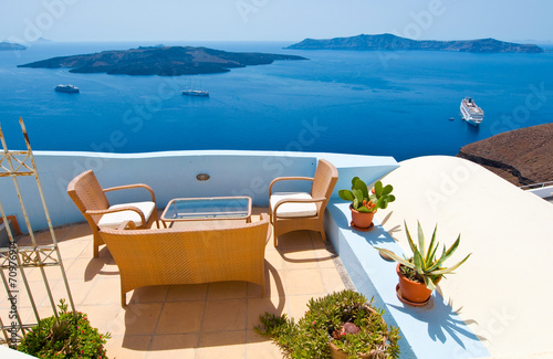 Patio with flowers in Fira. Thira (Santorini), Greece.