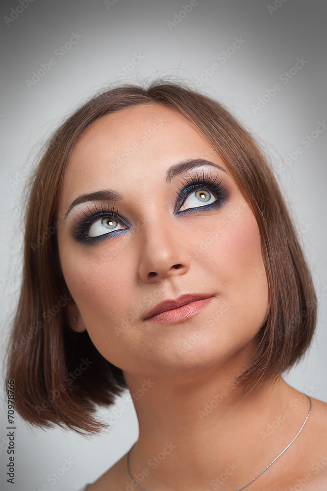 Portrait of the girl closeup on a gray background Portrait of the girl closeup on a gray background