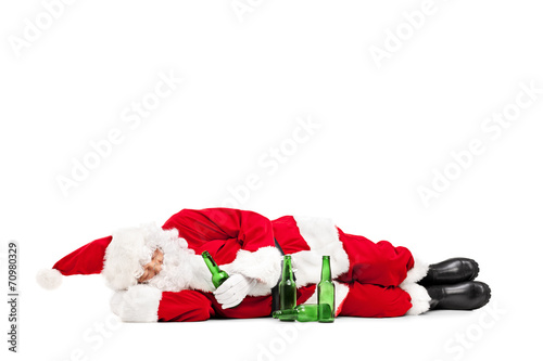 Drunk Santa Claus lying on the ground