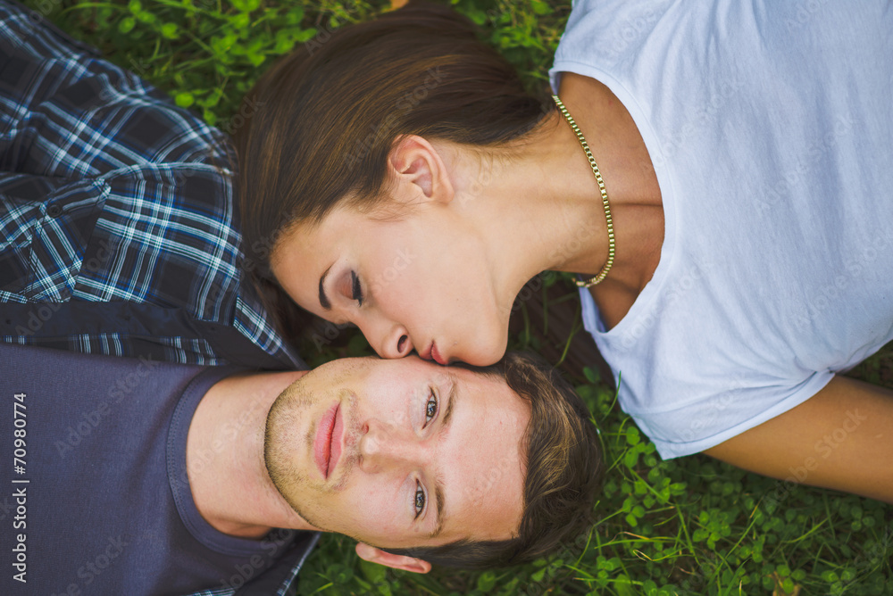 Couple lying on grass Couple lying on grass