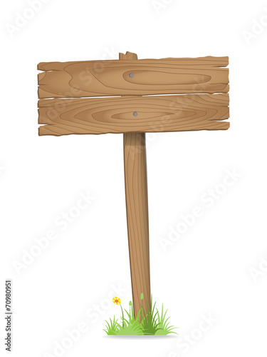 Wooden signpost on  grass with flower