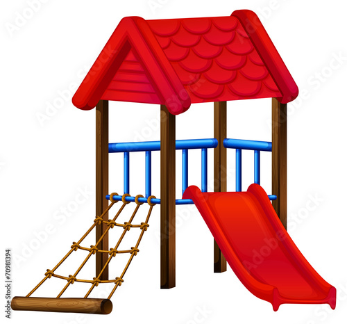 A toy house at the park with a slide